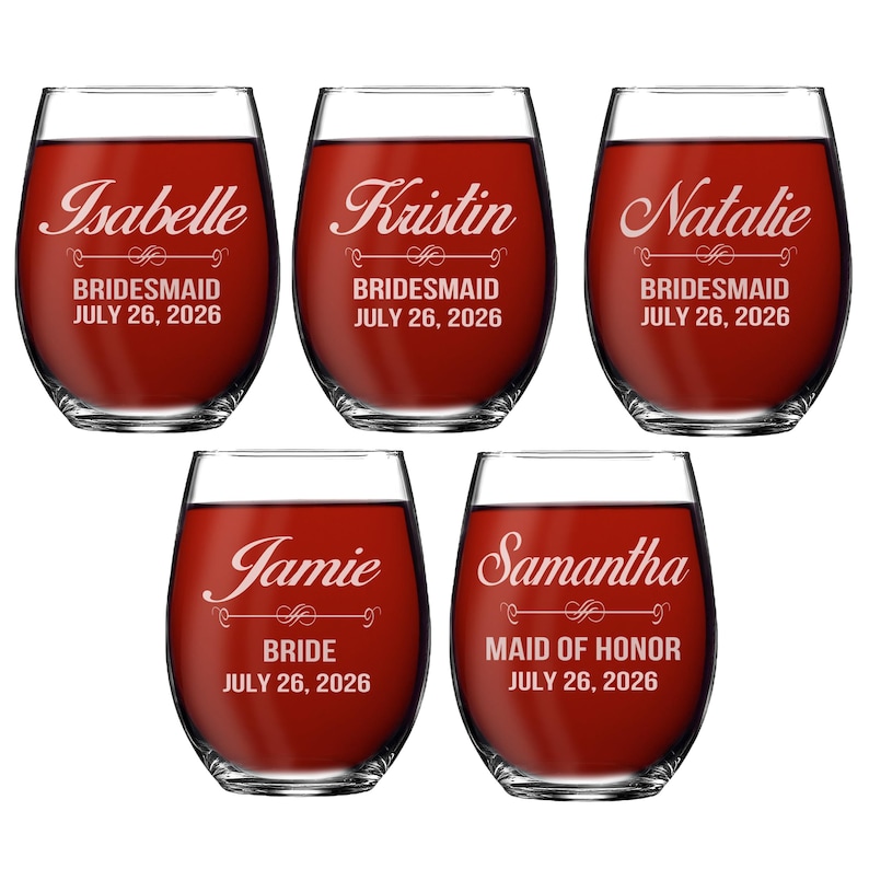 May include: Five clear stemless wine glasses filled with red liquid. Each glass is etched with a name, a title, and the date July 26, 2026. The names Isabelle, Kristin, Natalie, Jamie, and Samantha are featured along with BRIDESMAID, BRIDE, or MAID OF HONOR.