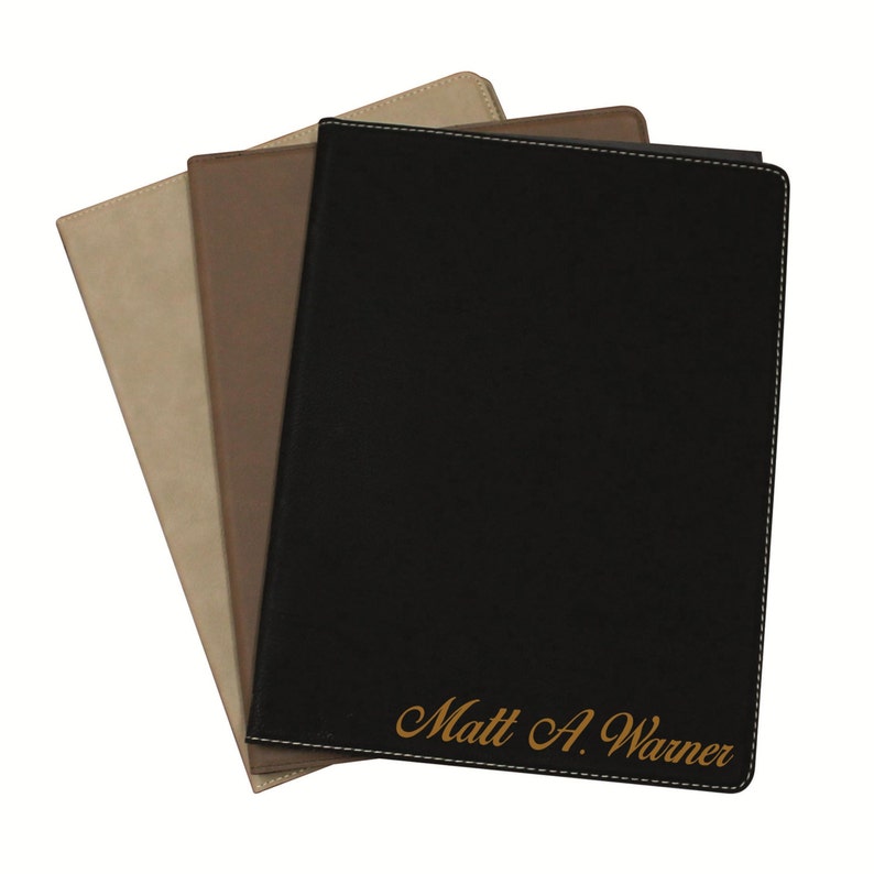May include: Three rectangular document folders in black, brown, and tan, each featuring stitched edges. The front black folder is personalized with the gold-colored text Matt A. Warner engraved in a cursive script font at the bottom right corner.