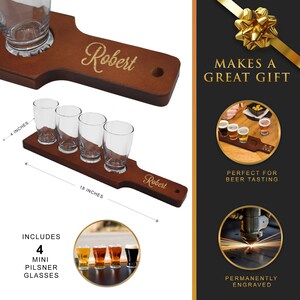May include: A wooden beer flight set with four mini pilsner glasses. The set is 18 inches long and 4 inches wide, with the name "Robert" engraved on the handle. The set includes four mini pilsner glasses.