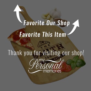 May include: A wooden pizza peel with a slice of pepperoni pizza. The peel has the text "THE SMITH FAMILY PIZZA HOUSE" and "my Personal memories". The image also includes garlic, tomatoes, and basil.