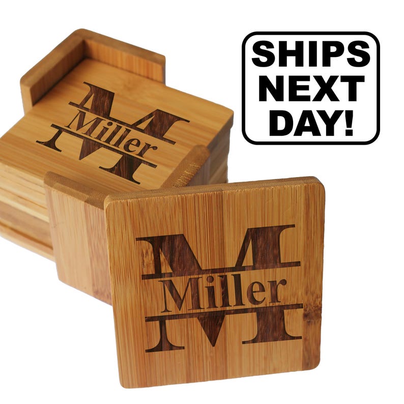May include: A set of square bamboo coasters with a wooden holder. Each coaster features a laser-engraved large letter M with the name Miller centered across it. A white rectangular graphic with black text reads SHIPS NEXT DAY! in the corner.
