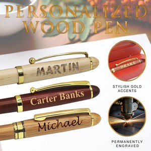 May include: Three personalized wooden pens with gold accents. The pens are engraved with the names "Martin", "Carter Banks", and "Michael".