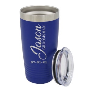 May include: A blue stainless steel tumbler with a lid. The tumbler has the name "Jason Groomman" and the date "07-31-21" engraved on it.