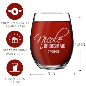May include: A stemless wine glass filled with red liquid, featuring the white etched text Nicole, BRIDESMAID, and 07-26-26. The glass measures 4.3 inches in height and 3 inches in width, with a capacity of 15 ounces as indicated by the text.