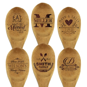 May include: Six wooden spoons with engraved designs. One spoon reads "Eat, drink, and be Married" with a date. Another features "Miller" and a large letter "M". Other spoons display "Mark & Sally" with a heart, "Wilson's Family Kitchen", "Smith Family", and "Drake".