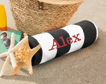 May include: A black and white striped beach towel with the name "Alex" embroidered in red.