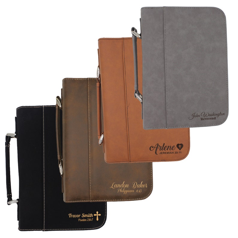 May include: Four leather Bible covers in black, brown, and tan. Each cover has a handle and a silver-tone clasp. The covers are personalized with names and Bible verses, including "Trevor Smith Psalm 28:7" and "Landon Baker Philippians 4:13".