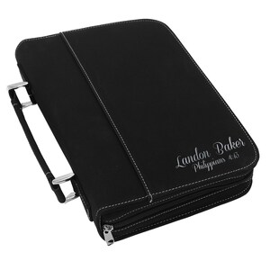 May include: Black leather Bible cover with white stitching and a silver zipper. The cover has a handle and the name "Landon Baker" and "Philippians 4:13" printed on the front.