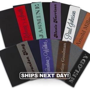 May include: A collection of rectangular bookmarks in various colors including red, teal, purple, white, brown, gray, and black. Each bookmark features a personalized name engraved in different fonts, such as Rebecca Smith, Jasmine, Alexis Harrison, Paul Johnson, Arnold Miller, Brandon King, Valentina Walker, Destiny Goodman, and Melody.