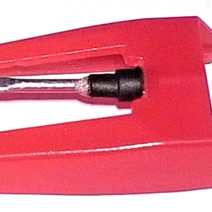 May include: A red plastic record player needle with a silver stylus.