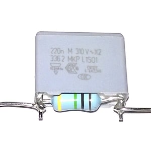 May include: A gray capacitor with the text "220n M 310 V~X2 336 2 MKP L1501" printed on it. The capacitor is connected to a blue and yellow striped resistor.