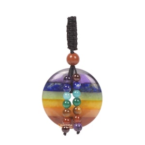 May include: A round, multi-colored chakra pendant with a black cord and beaded accents. The pendant features a layered design with colors including red, orange, yellow, green, blue, indigo, and purple. The pendant is approximately 2 inches in diameter.