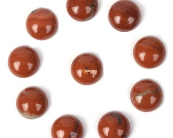 May include: Ten round, red jasper cabochons with brown and white markings. The cabochons are arranged in a circle on a white background.