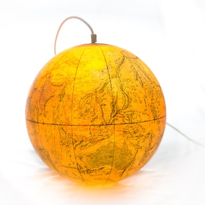 Lamp made of a vintage globe from the 1970 with white wire