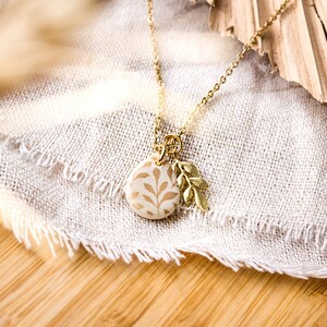 Leaf floral drop necklace cream black gold branch image 6