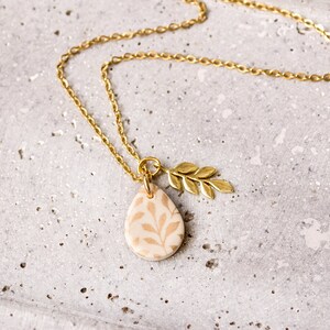 Leaf floral drop necklace cream black gold branch image 2