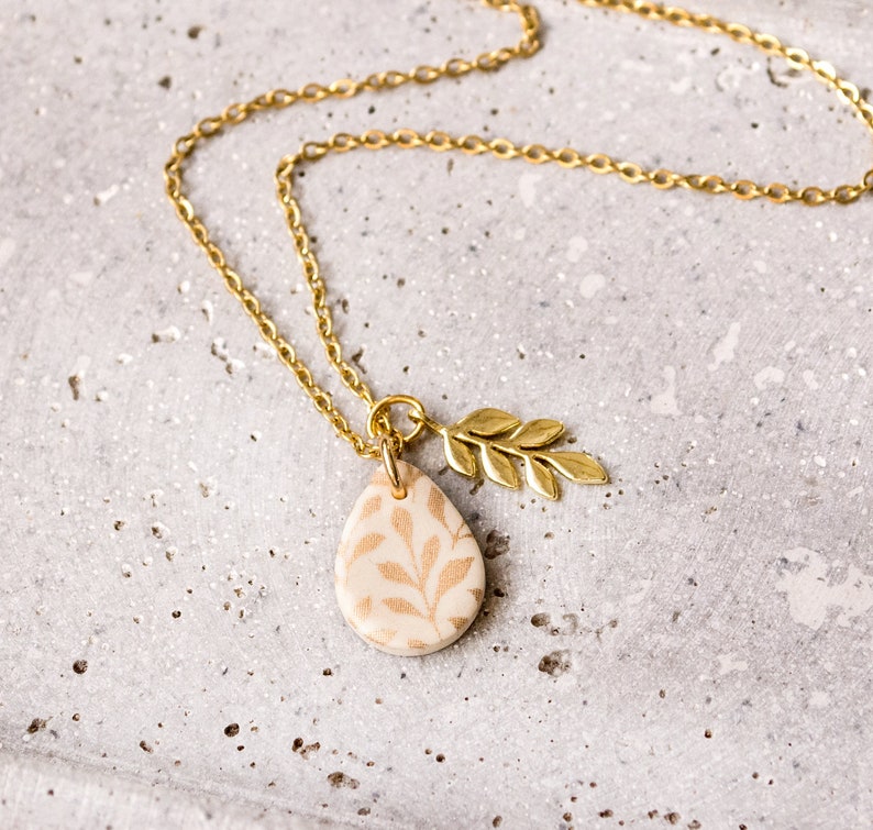 Leaf floral drop necklace cream black gold branch image 2