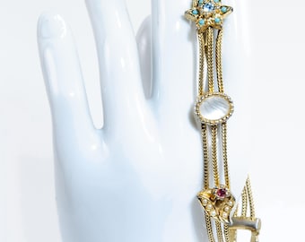 Pulsera deslizante vintage Goldette: dijes dorados de estilo victoriano.