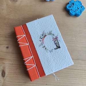 Taccuino con fiore in carta seminabile e scatola con dedica