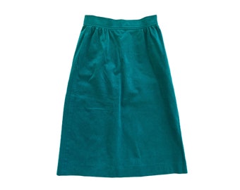 May include: A teal green corduroy skirt with a high waist and a straight, A-line silhouette.