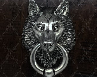 Battente per porta a testa di lupo con anello a sfera, nichelato, finitura satinata su fusione in bronzo