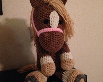 Stuffed horse with horseshoes