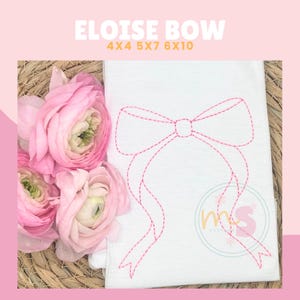May include: Pink and white fabric with a pink stitched bow design. The design is labeled "Eloise Bow 4x4 5x7 6x10".