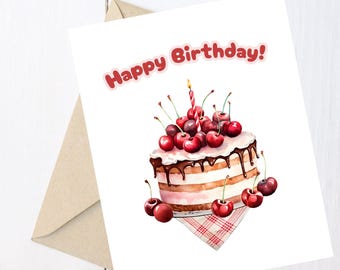 May include: A birthday greeting card with a watercolor illustration of a layered cake topped with cherries and a lit candle. The words "Happy Birthday!" are in red. A brown envelope is visible.