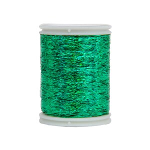 Puede incluir: Una bobina de hilo met&aacute;lico verde con una bobina de pl&aacute;stico blanca.