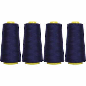 May include: Four spools of dark blue thread, each with a yellow plastic top.
