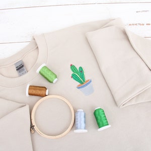 a t - shirt with a cactus design on it