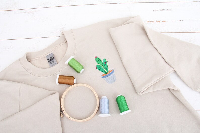 a t - shirt with a cactus design on it