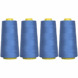 May include: Four spools of blue thread with yellow tops.