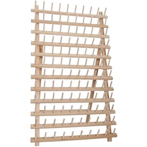 May include: A wooden needle threader with a triangular base and multiple rows of pegs for holding needles.