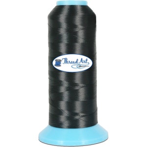 May include: A spool of black thread with a blue base and the text "Thread Art" on a white oval label.