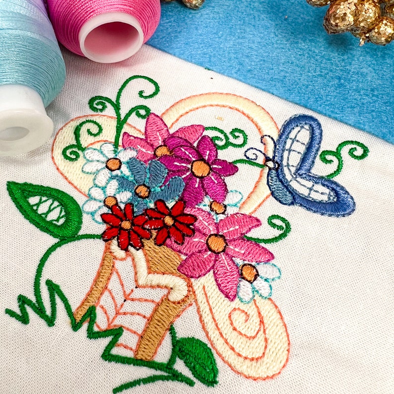 a close up of a piece of embroidery on a table