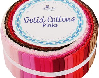 May include: A roll of 48 2.5-inch by 44-inch fabric strips in various shades of pink. The label reads "100% Cotton Fabric/Quilting Quality Thread Art, Solid Cottons Pinks 48 Count / 20 Colors / 2.5" x 44" Strips".