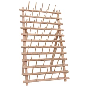May include: A wooden thread spool holder with multiple pegs for organizing spools of thread. The natural wood color and grid-like structure provide a functional and aesthetic storage solution for sewing enthusiasts.