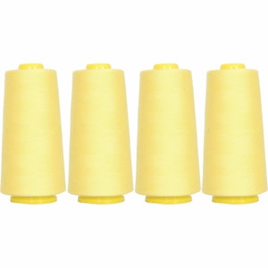 May include: Four spools of yellow thread, each with a yellow plastic cap.