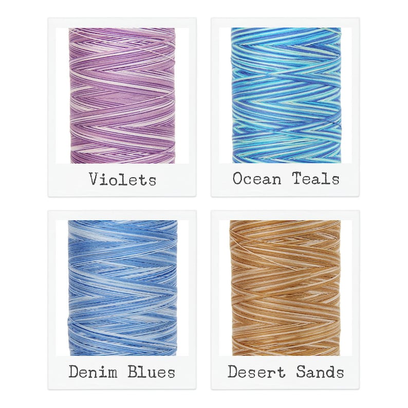 May include: Four spools of embroidery floss, each with a different color pattern. The spools are labeled "Violets", "Ocean Teals", "Denim Blues", and "Desert Sands".