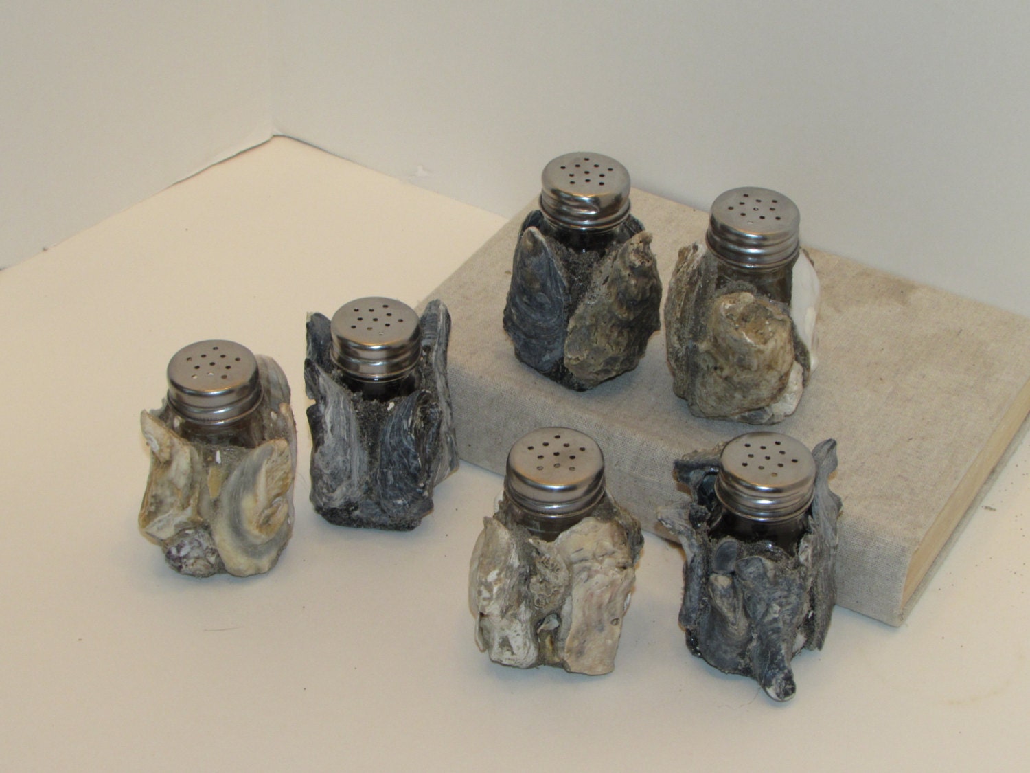 Salt and pepper shakers covered in oyster shells Etsy