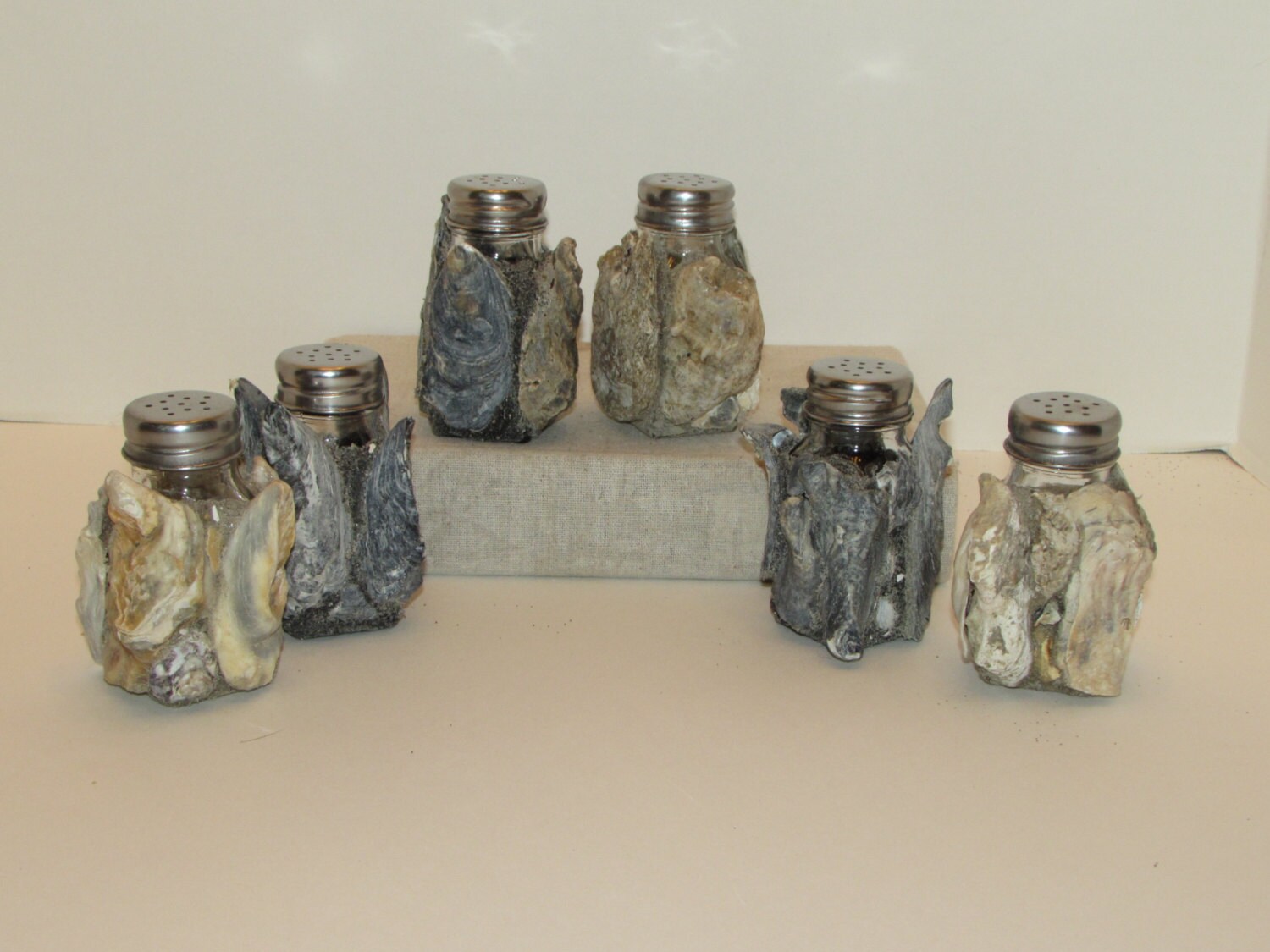 Salt and pepper shakers covered in oyster shells Etsy