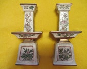 REDUCED PRICE Pair of Oriental vintage 8 inch tall antiqued white and gold candleholders with 4 different panels of flowers from Macau