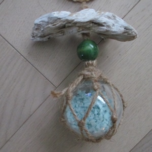 Light aqua tiny pebbles in Clear plastic  float with fishing net , sea shell ,green wood bead , driftwood
