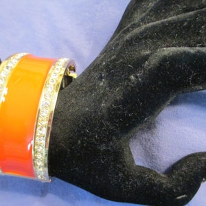 Orange enamel hinged rhinestone gold tone bangle   / cuff bracelet