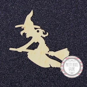 May include: Wooden cutout of a witch flying on a broomstick. The witch is wearing a pointed hat and has long hair. The cutout is unpainted and has a natural wood finish. The image also includes a logo for "Pretty Beads Galore".
