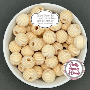 May include: A collection of light-colored, wooden beads with a grooved, spherical design, displayed in a white bowl. The beads have a natural wood tone. The image includes text that reads "Ships Same Day if ordered before 1pm ET Mon-Fri (except on holidays)".