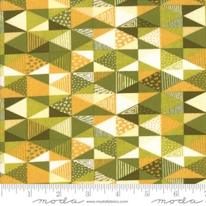 May include: A fabric with a geometric pattern of yellow, green, and white triangles. The fabric has a variety of textures and patterns within the triangles.