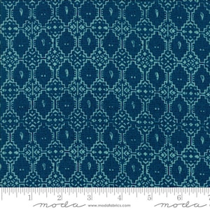 May include: Teal blue fabric with a white geometric pattern. The pattern features a repeating design of squares and diamonds with a paisley-like motif in the center of each square. The fabric is textured and has a subtle sheen.