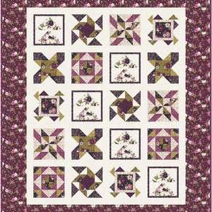 Könnte beinhalten: Ein Quiltblockmuster mit weißem Hintergrund und 16 verschiedenen Blöcken. Die Blöcke bestehen aus verschiedenen Kombinationen von violetten, grünen und weißen Stoffen. Die Blöcke sind in einem 4x4-Raster angeordnet.